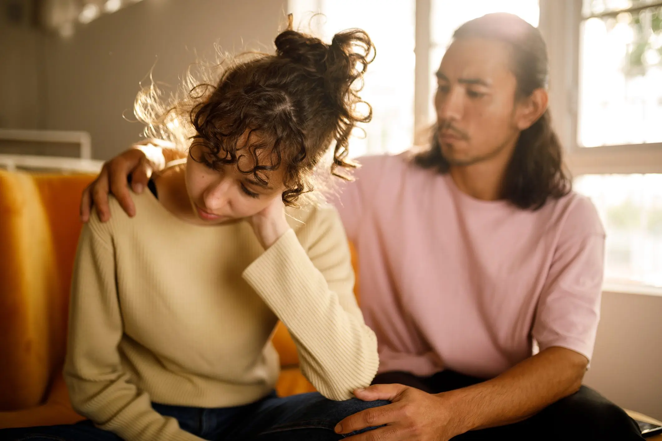 A boyfriend attempts to comfort his depressed girlfriend.